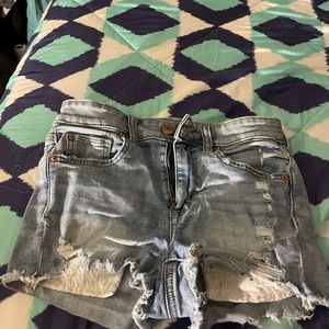 High waisted jean shorts with floral pockets